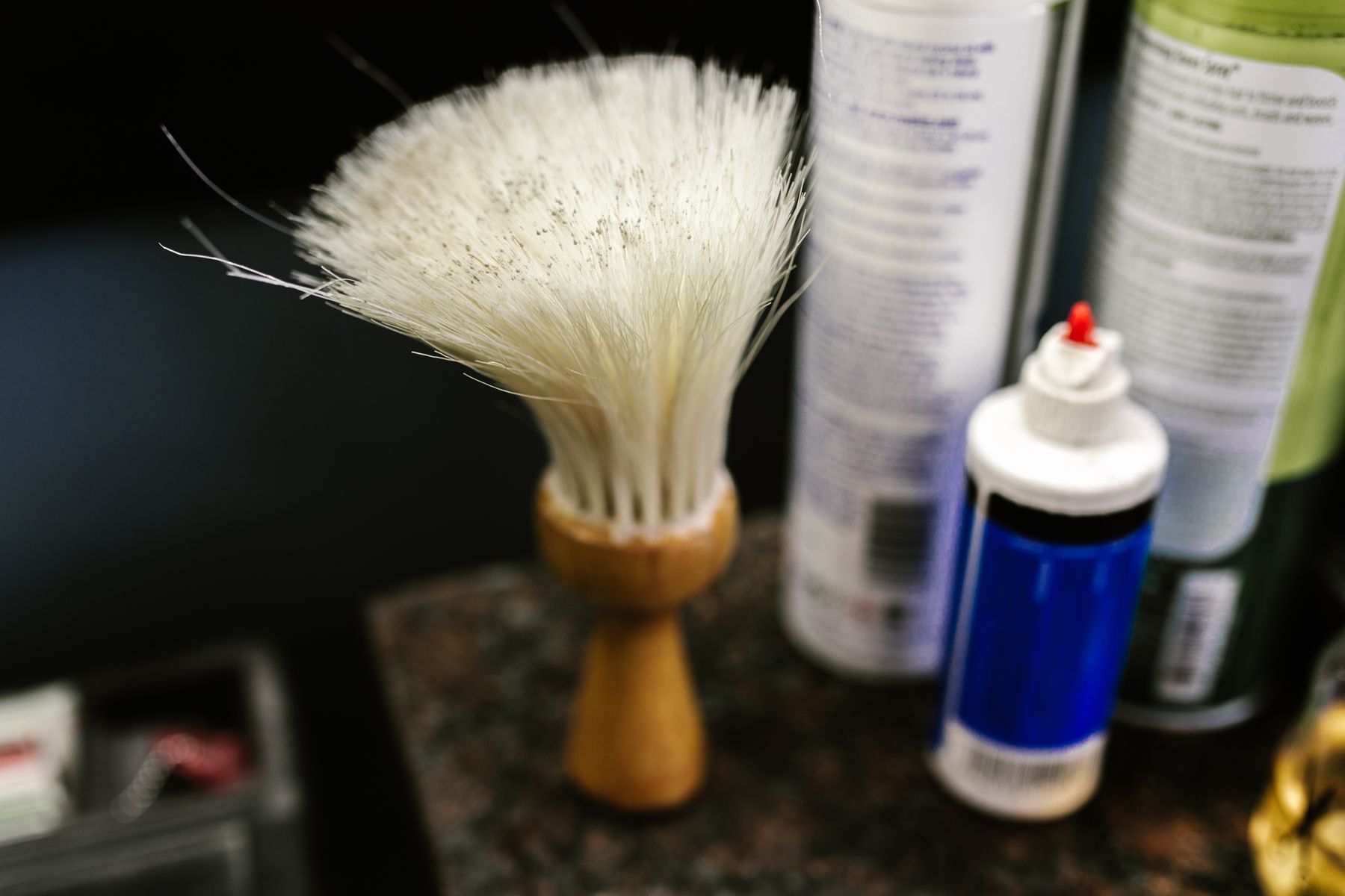 Barber trimming a customer’s hair