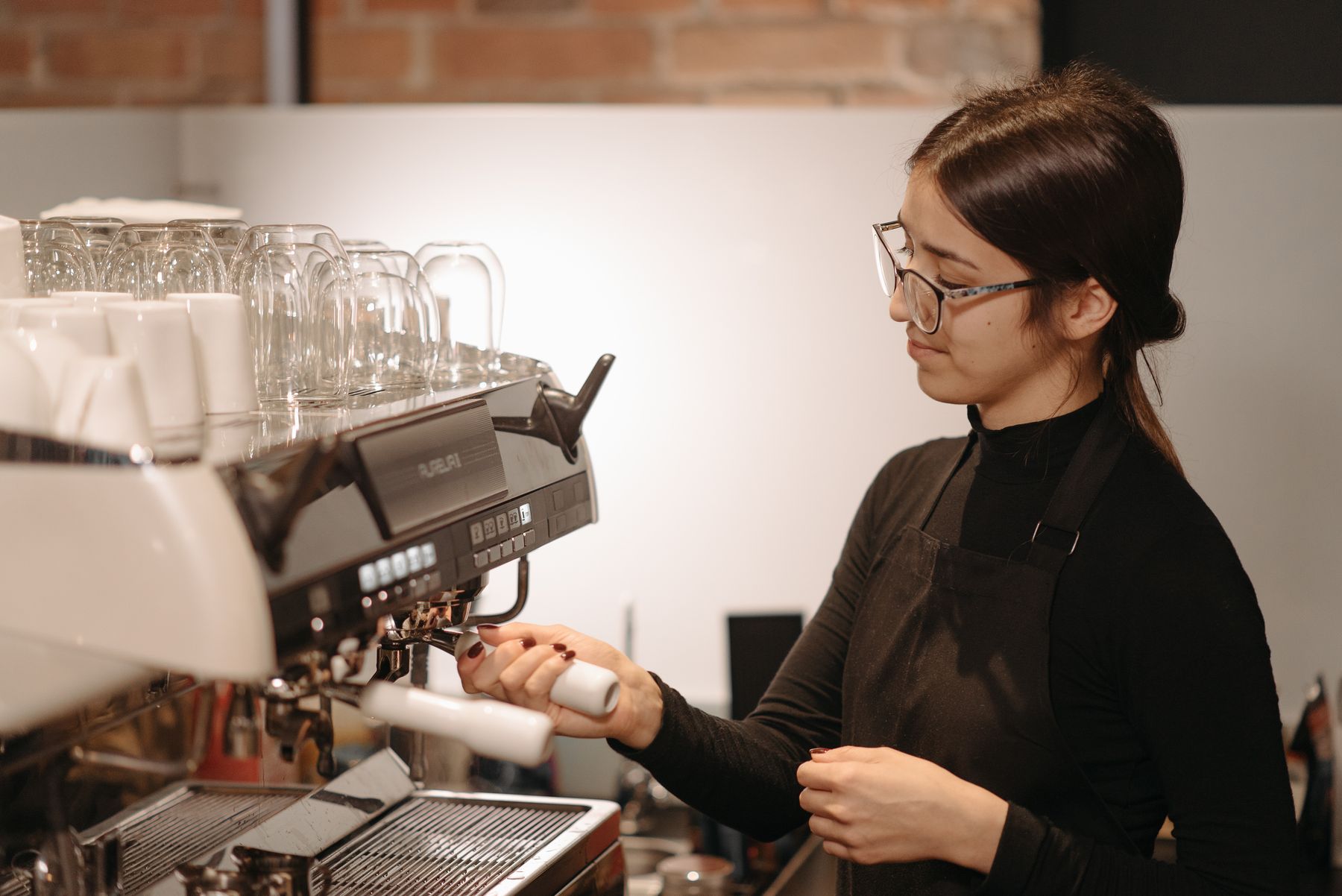 Barista at the espresso machine