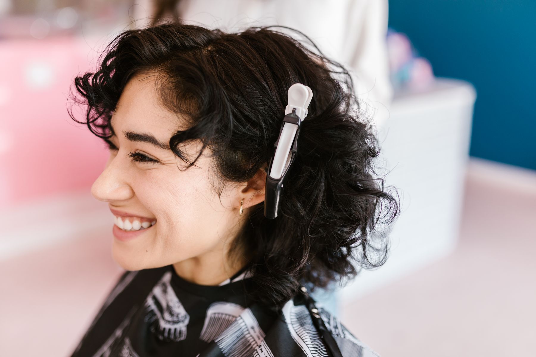 Smiling customer in a salon chair